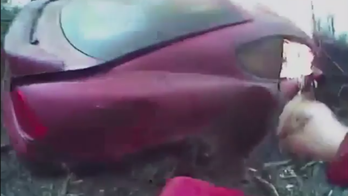 Body cam footage shows Oklahoma deputy rescuing driver from burning car