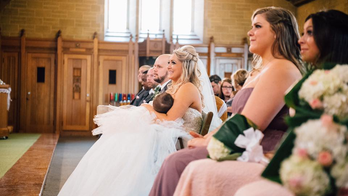 Photo of bride breastfeeding daughter during ceremony goes viral