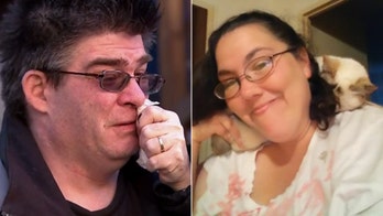 Massachusetts man discovers wife pinned against building after car crash