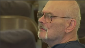 Washington state man arrested after killing intruder in shower, police say