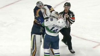 Alex Burrows had a busy night getting under the skin of Sabres goalie Robin Lehner