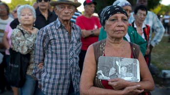 The Latest: Thousands lining up early to pay homage to Fidel