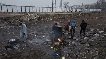 The Latest: Britain puts limit on unaccompanied minors