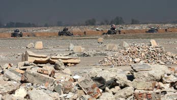 IS stashed treasures in trenches, smashed walls to shock