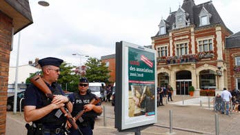 The Latest: Hollande suspects IS in church attack