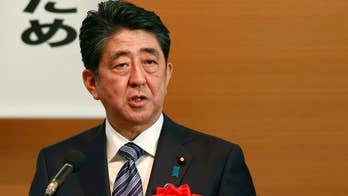 Japan PM says he will initiate debate on new constitution