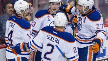 Oilers beat Canucks 3-2, clinch at least second in Pacific