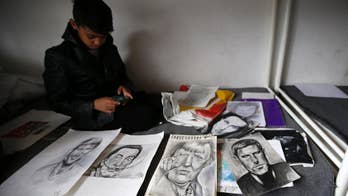 'Little Picasso' draws admiration in squalid Serbian camp