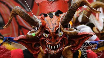 AP PHOTOS: Masked devils dance in Ecuadorean mountain town