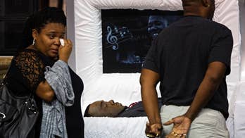 The Latest: Stream of mourners pay respect to Alton Sterling