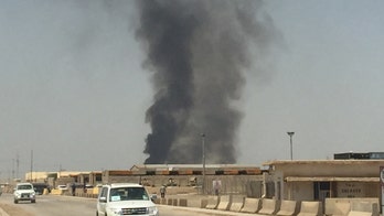 Burn pits near US military bases in Iraq keep smoldering, as health debate rages