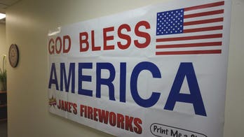 'God Bless America' signs fly after atheist group targets post office banner