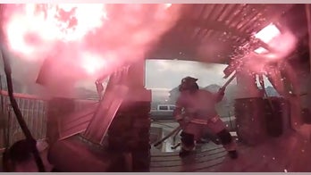 Firefighters' dramatic attempt to save house from wildfire captured on camera