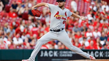 Cardinals rookie's no-hit bid broken up by fire alarm, then Reds