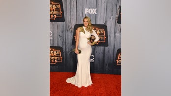 Carrie Underwood donates guitar to help save canine officer