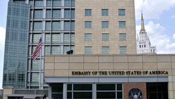 Russian TV shows guard tackling, fighting US diplomat outside embassy