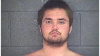 Shark spotted swimming near man trying to escape police custody