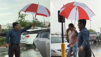 Chick-fil-A employee holds umbrella for customers in pouring rain, goes viral