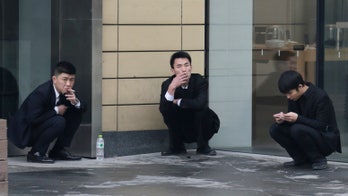 China parliament weighs tough curbs on tobacco advertising