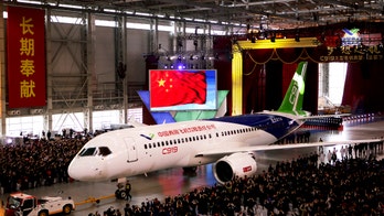China unveils jetliner in bid to compete with Boeing, Airbus