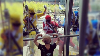 Window washing Power Rangers surprise patients at Philadelphia children's hospital