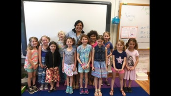 Students rock pigtails in show of support for classmate with hearing aid