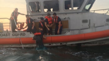 Coast Guard rescues 4 adults, 1 child from capsized boat off North Carolina