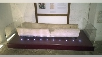 800-year-old coffin breaks after child put in it for photo op