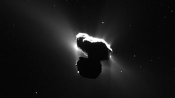 Rosetta spacecraft scoops up surprise speck of fluffy comet dust