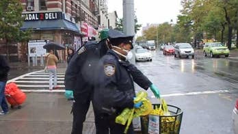 Cops leave Ebola doctor's apartment and dump protective gloves and masks in sidewalk trash can