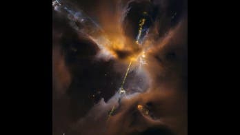 Cosmic lightsaber slices through clouds in awesome new image