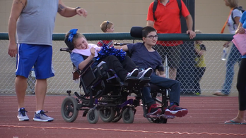 High school arranges dance proposal for teens with cerebral palsy