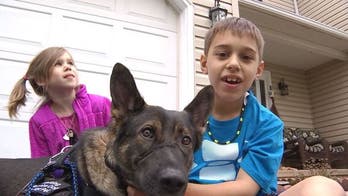Pennsylvania boy with cerebral palsy training for a triathlon with service dog
