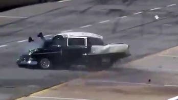 Drag racer crashes feet-first through windshield, strolls away