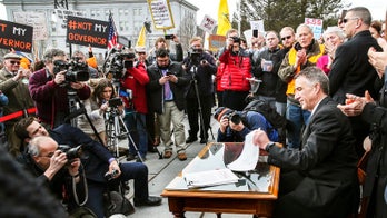 Protesters heckle 'traitor' Vermont GOP gov after he signs gun control legislation