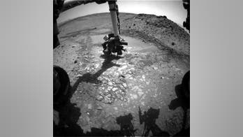 Curiosity rover packs up drill, hits the Martian road again