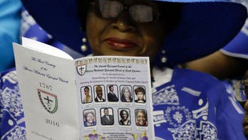 The Latest: Security tight as church victims remembered