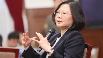 Taiwan leader urges China for 'calm' talks as pressure grows