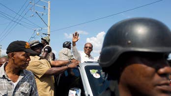 Former President Aristide leaps from behind scenes in Haiti