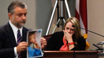 Ex-wife pressed on dark side of dad in son's hot car death