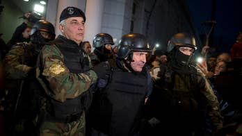 Argentina: Ex-official caught with millions now in hospital