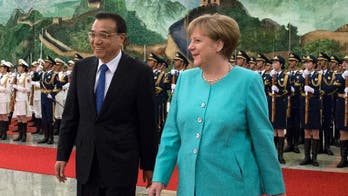 Angela Merkel meets with Chinese premier amid trade concerns