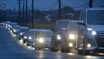 The Latest: Japan residents flee after tsunami warning