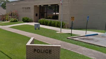 Alabama officers suspended for making alleged 'white power' hand gesture in photo