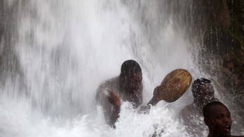 Haitians trek to sacred waterfalls in annual festival