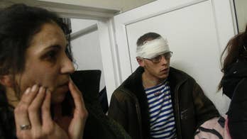 Eastern Ukraine shelling hits both sides