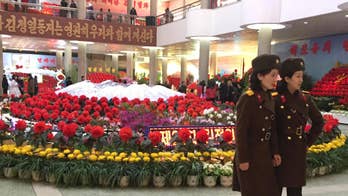 North Korea celebrates its late leader, and missile launch