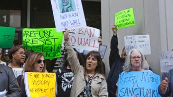 The Latest: UN experts denounce Trump's ban on travel to US