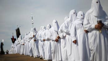AP PHOTOS: Hooded penitents celebrate Easter in Spain