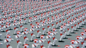 Do the robot: 1,000-plus dancing droids break record
